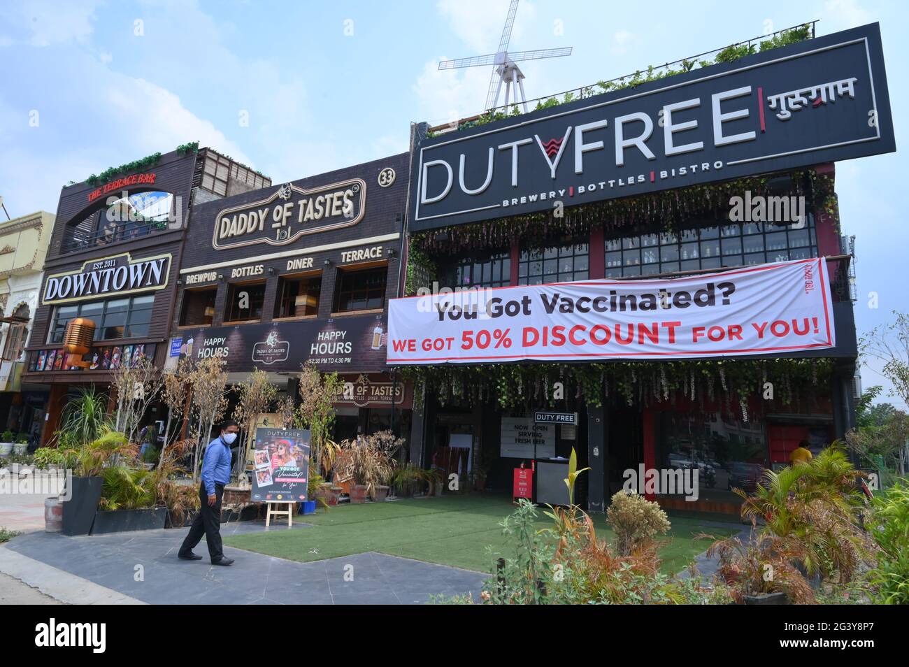 To make people aware about vaccination, hotel and restaurant operators in Gurugram, giving discount. gurgaon.india. Stock Photo