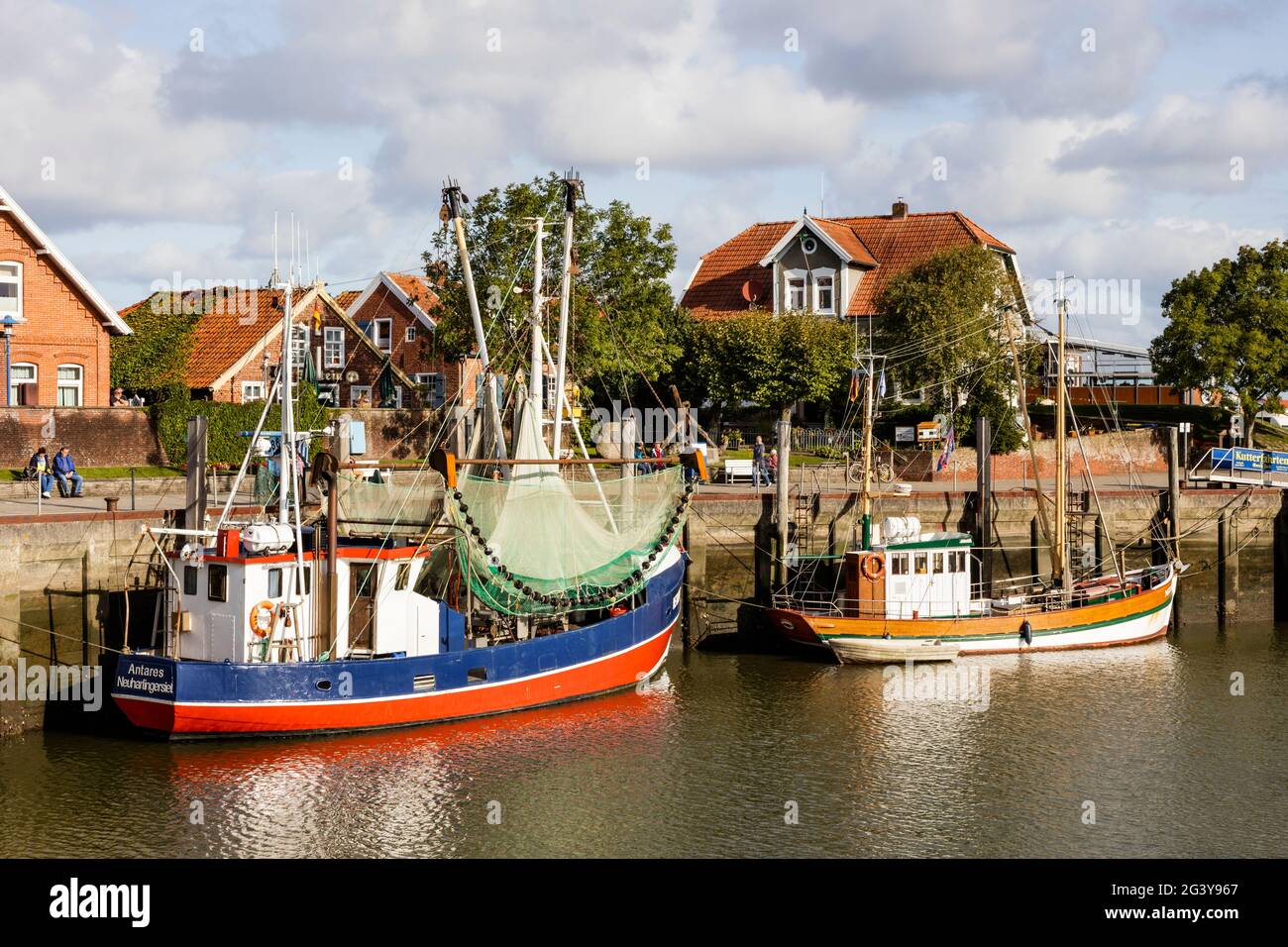 Harbor with shrimp cutters, boats,, Neuharlingersiel, East Friesland, Lower Saxony, Germany Stock Photo