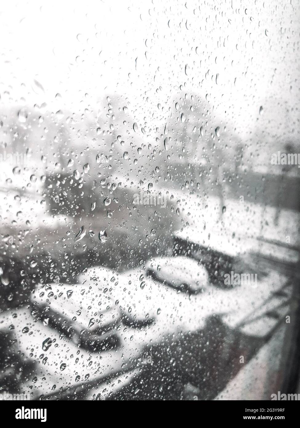 Photo of a window with water drops on during winter storm Stock Photo ...