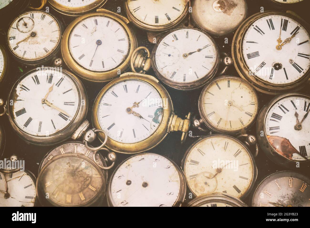 Retro styled image of old scratched and run down pocket watches Stock Photo