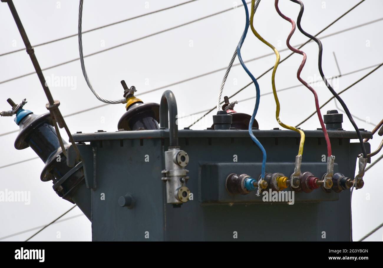 Electric power transformer, connected with transmission cables. Stock Photo