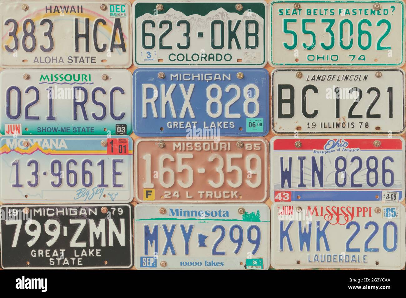 Drempt, The Netherlands - September 5, 2019: Retro styled image of old car license plates on a wall in Drempt, The Netherlands. Stock Photo