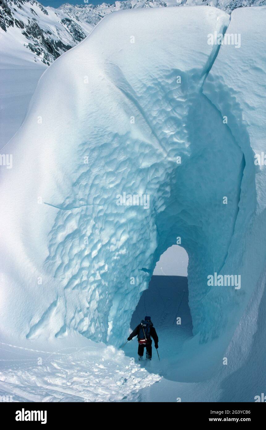 New Zealand. Mount Cook National Park. Cross country skier in ice tunnel. Stock Photo