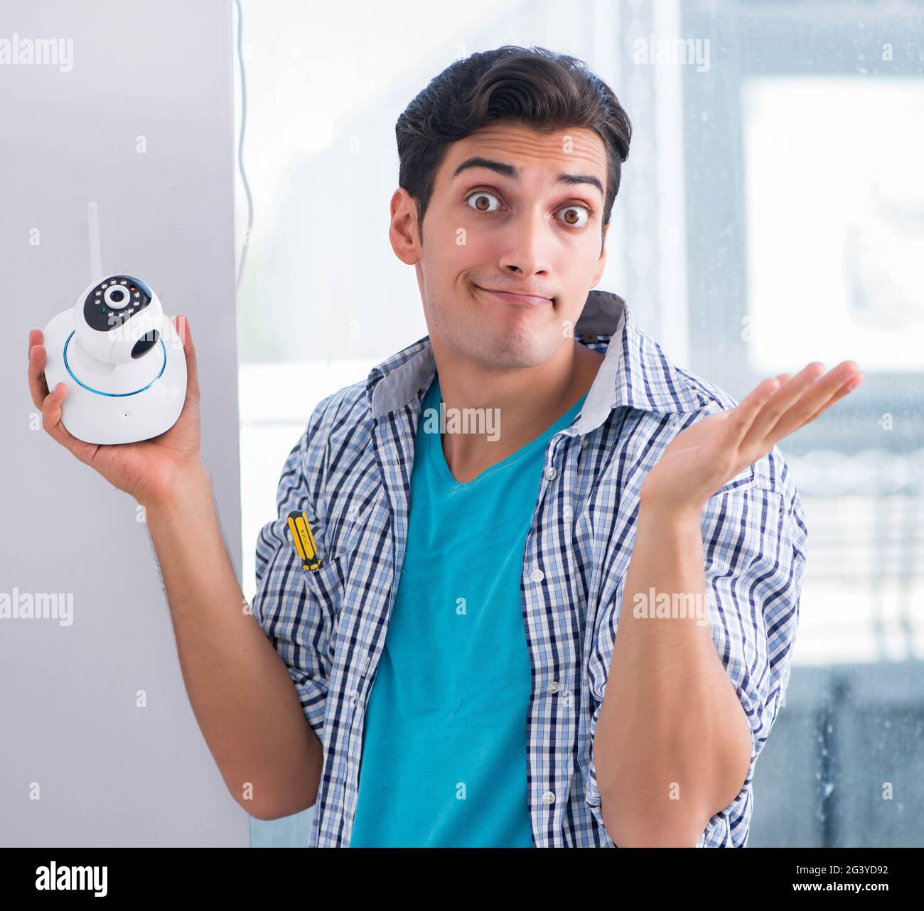 Man installing surveillance CCTV cameras at home Stock Photo Alamy