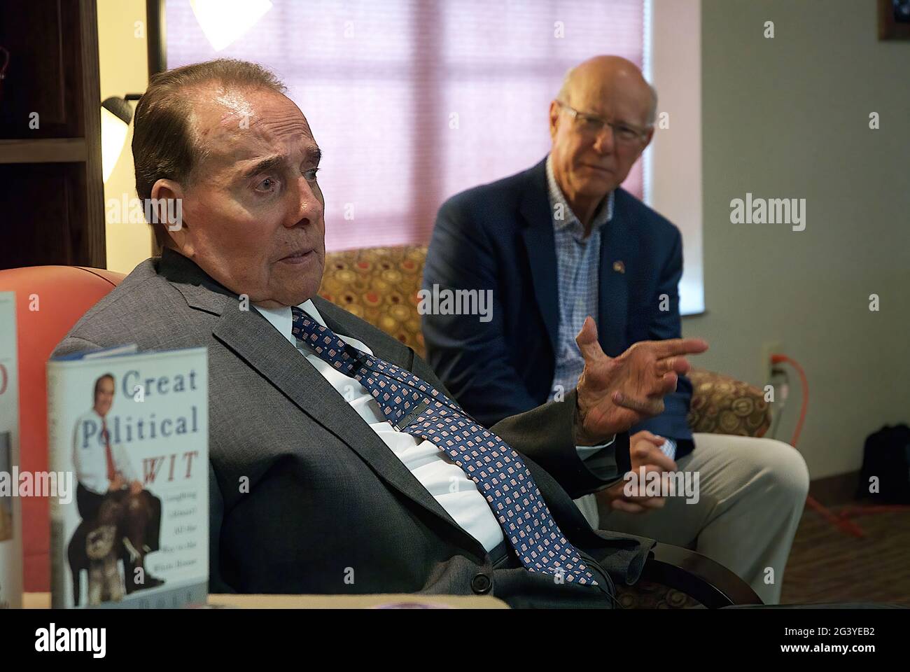 Former Senator Robert Dole (R-KS) visits with supporters at the Greensburg Senior Center, while Sen. Pat Roberts (R-KS) sits along side of him. Greensburg was destroyed by an F5 tornado in 2007 and now has been rebuilt with massive amount of help from FEMA. Stock Photo