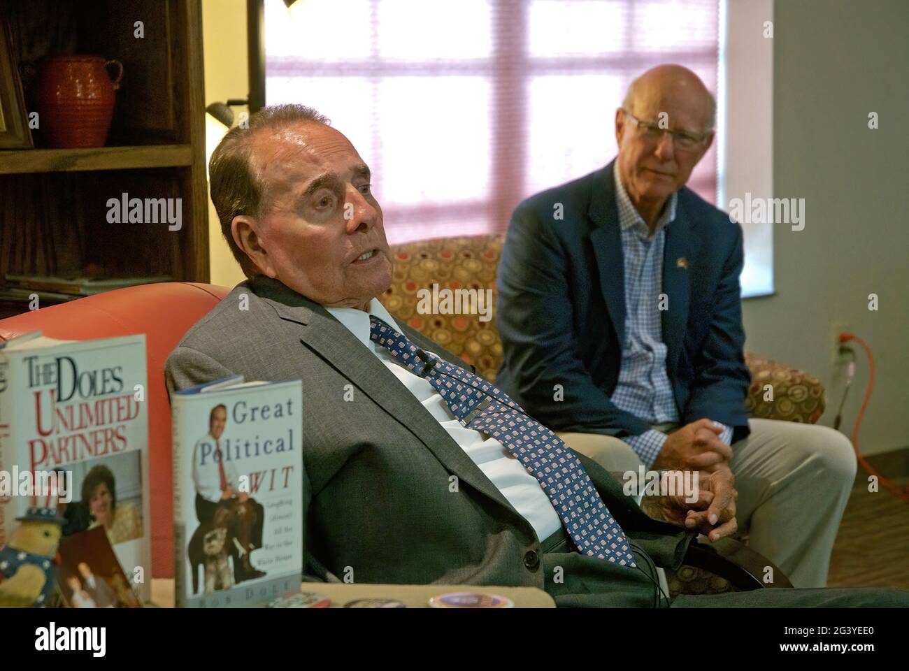 Former Senator Robert Dole (R-KS) visits with supporters at the Greensburg Senior Center, while Sen. Pat Roberts (R-KS) sits along side of him. Greensburg was destroyed by an F5 tornado in 2007 and now has been rebuilt with massive amount of help from FEMA. Stock Photo