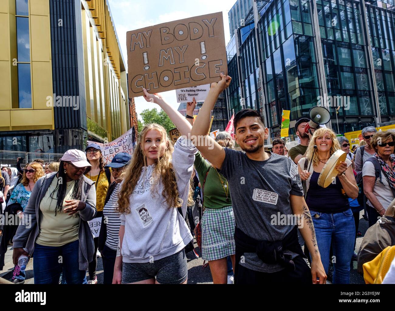 Anti-Vax anti-lockdown protesters march through central London protesting the governments Covid measures including vaccination passports and restrictions on opening lockdown.May 29 2021 Stock Photo