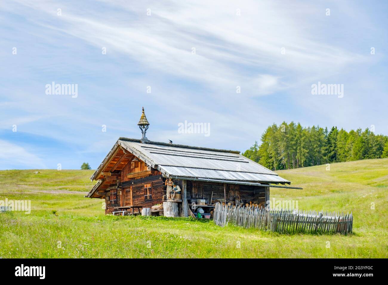 Old log cabin on an alp meadow in the summer Stock Photo