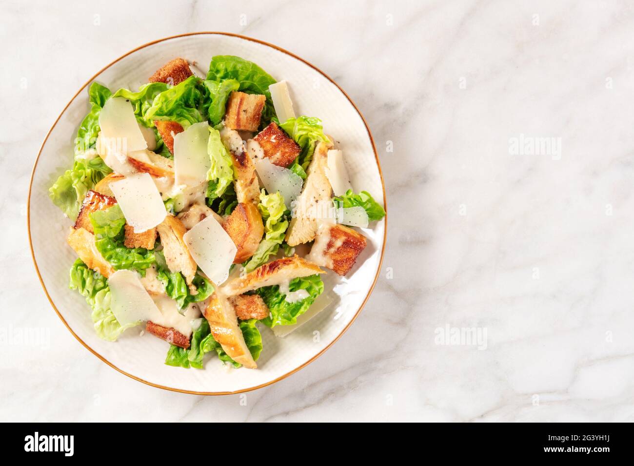 Caesar salad with grilled chicken, romaine and cheese Stock Photo