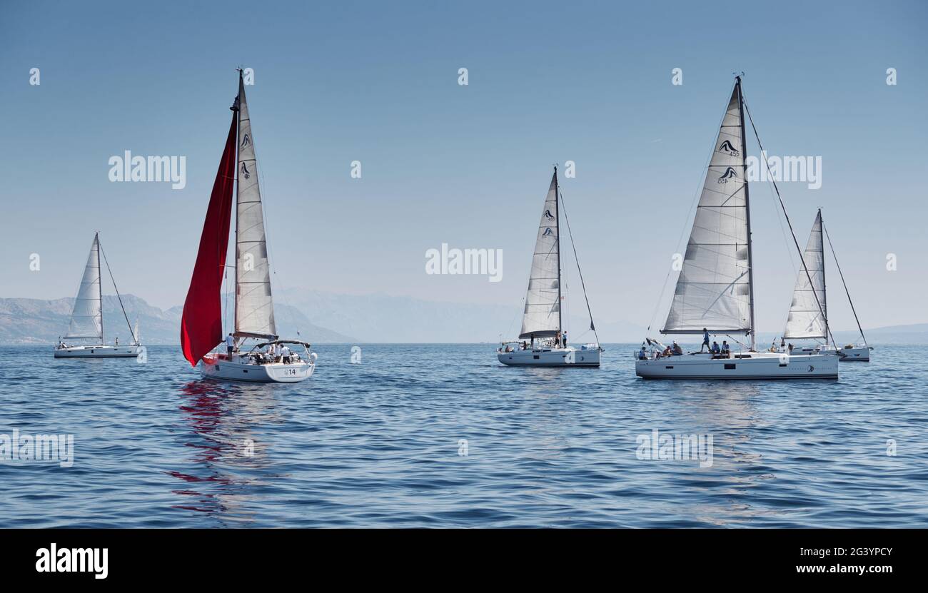 Croatia, Adriatic Sea, 15 September 2019: The race of sailboats, a regatta, reflection of sails on water, Intense competition, b Stock Photo