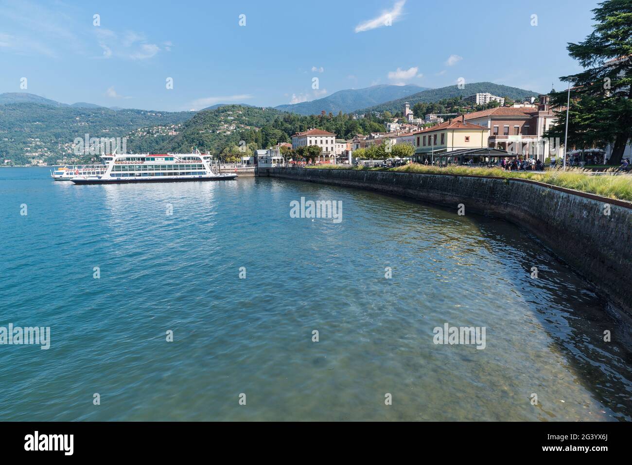 Lake Maggiore, Italy. Lakeside of the town of Luino with tourist ferry Stock Photo