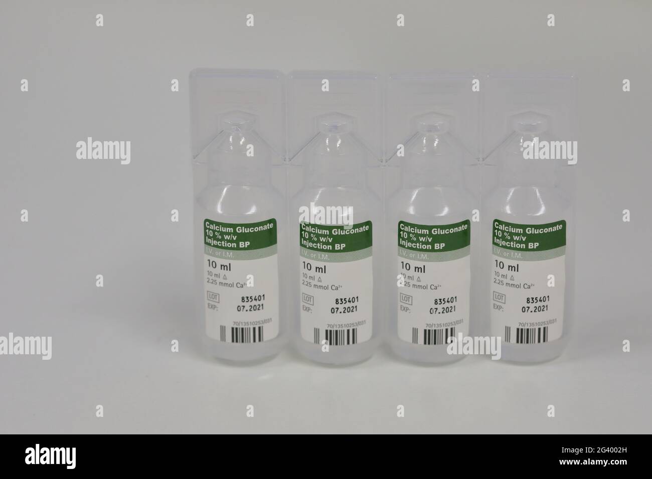 Four plastic vials of  Calcium Gluconate (C12H22CaO14) injection Stock Photo