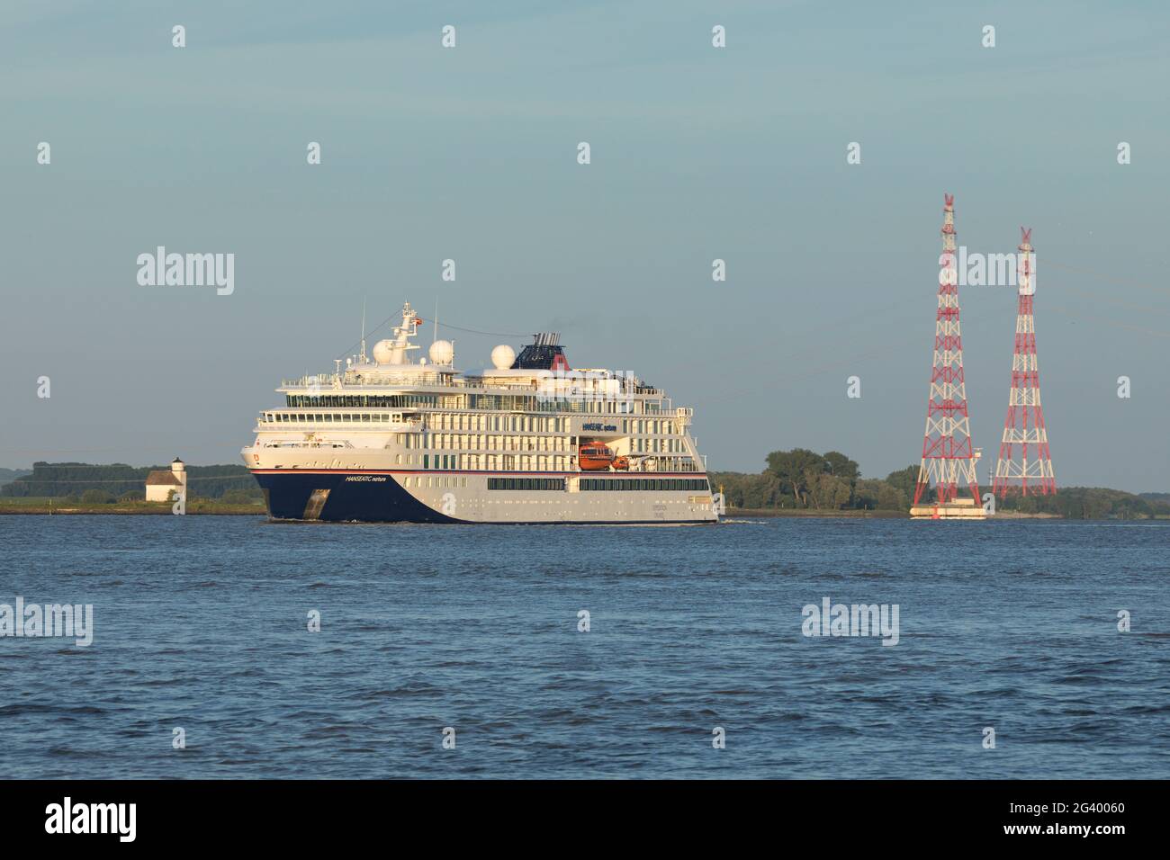 Stade, Germany - June15, 2021: Expedition cruise ship HANSEATIC NATURE on Elbe river on a voyage to Norway Stock Photo