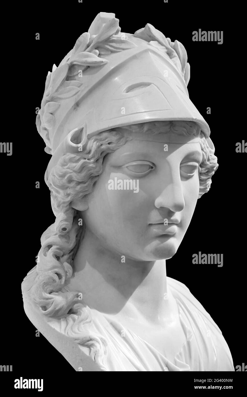 Ancient Greek goddess Athena Pallas statue isolated on black. Marble woman head in helmet sculpture. Stock Photo