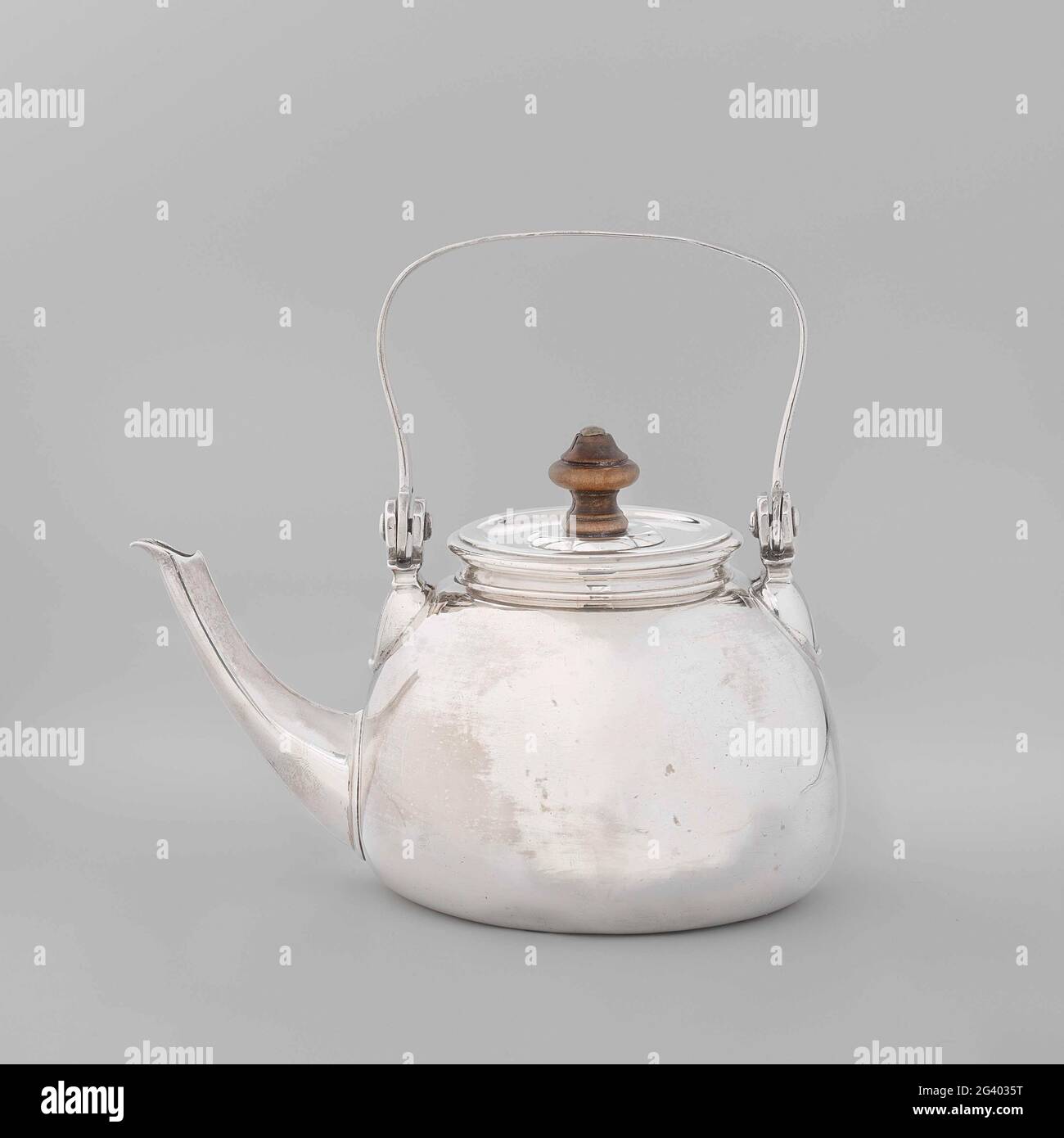 Silver tea kettle with engraved coat of arms of the Beaumont family