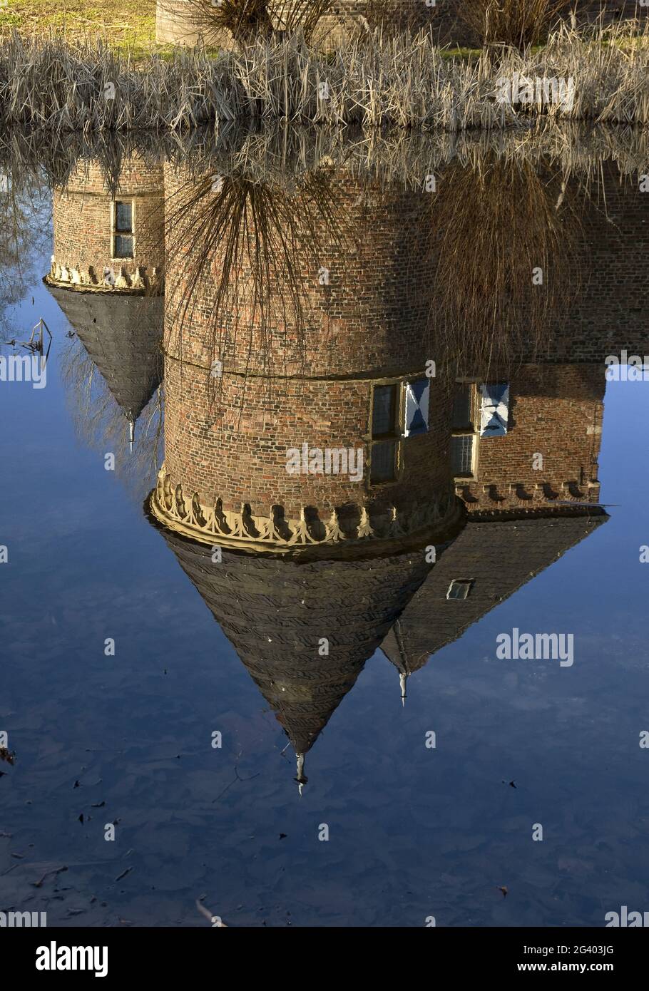 The towers of Vondern Castle are reflected in the water, Oberhausen, Ruhr Area, Germany, Europe Stock Photo