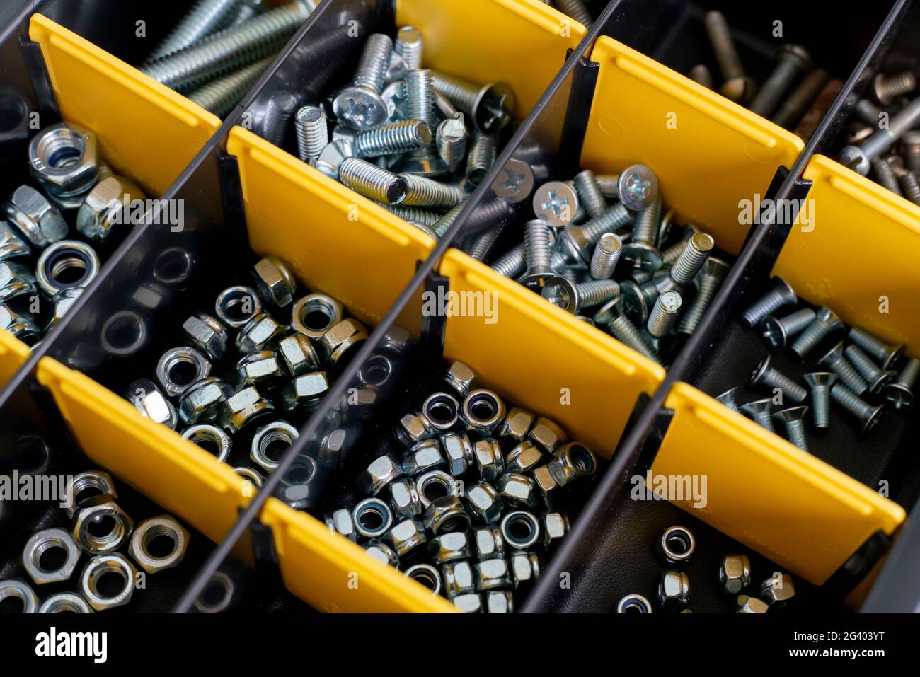 Tool box with cells with screws, anchors, nails, bolts and other tools