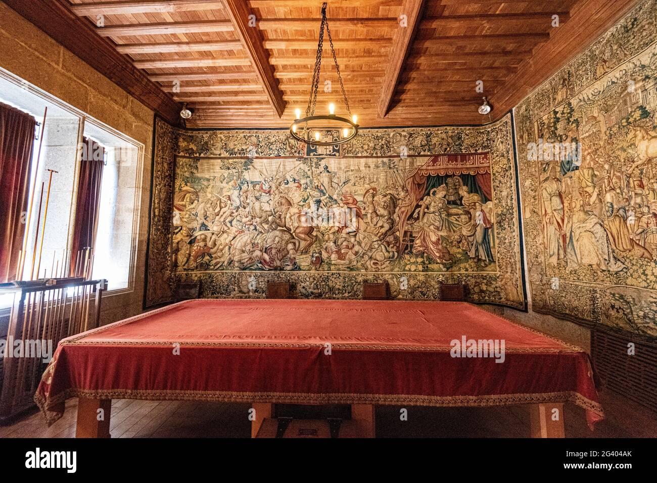 Old billiard table covered in a room lined with tapestries, Castle Drogo, Dartmoor, Devon, Stock Photo