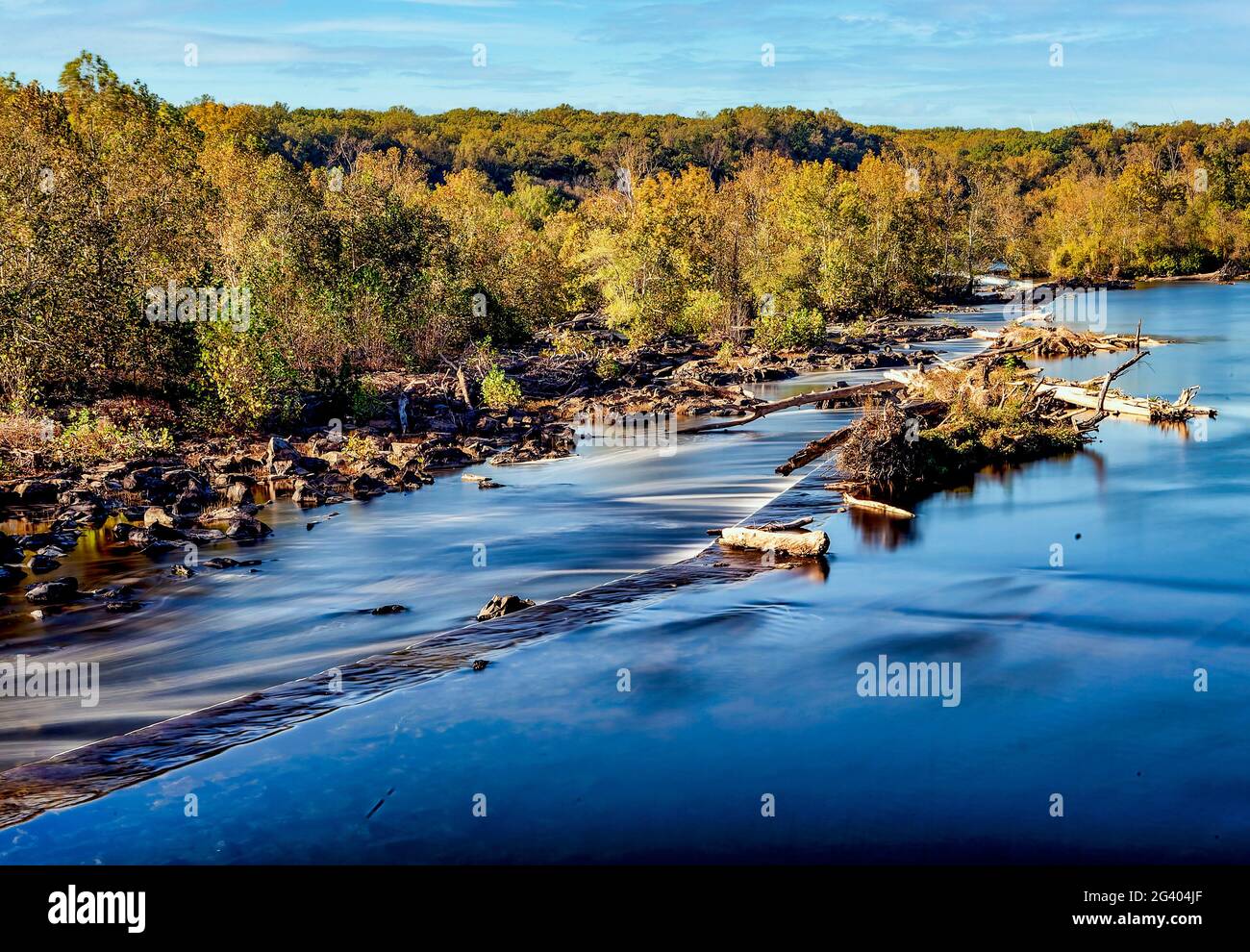 Weir on a swollen river Stock Photo