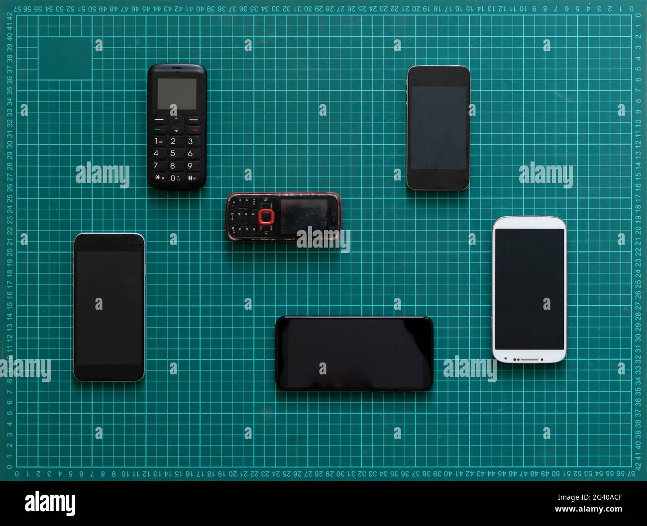 technology evolution concept, some old vintage phone cell phones and new nodern devices Stock Photo