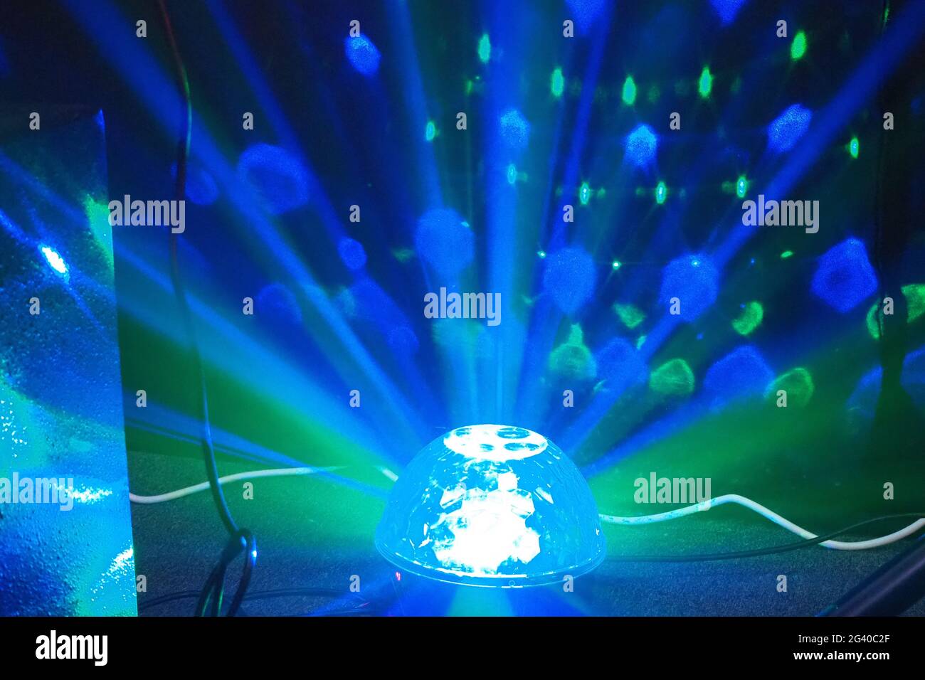 Radiating rainbow colours from a spinning floor dome light BPM 2019 - The Show for DJs Stock Photo