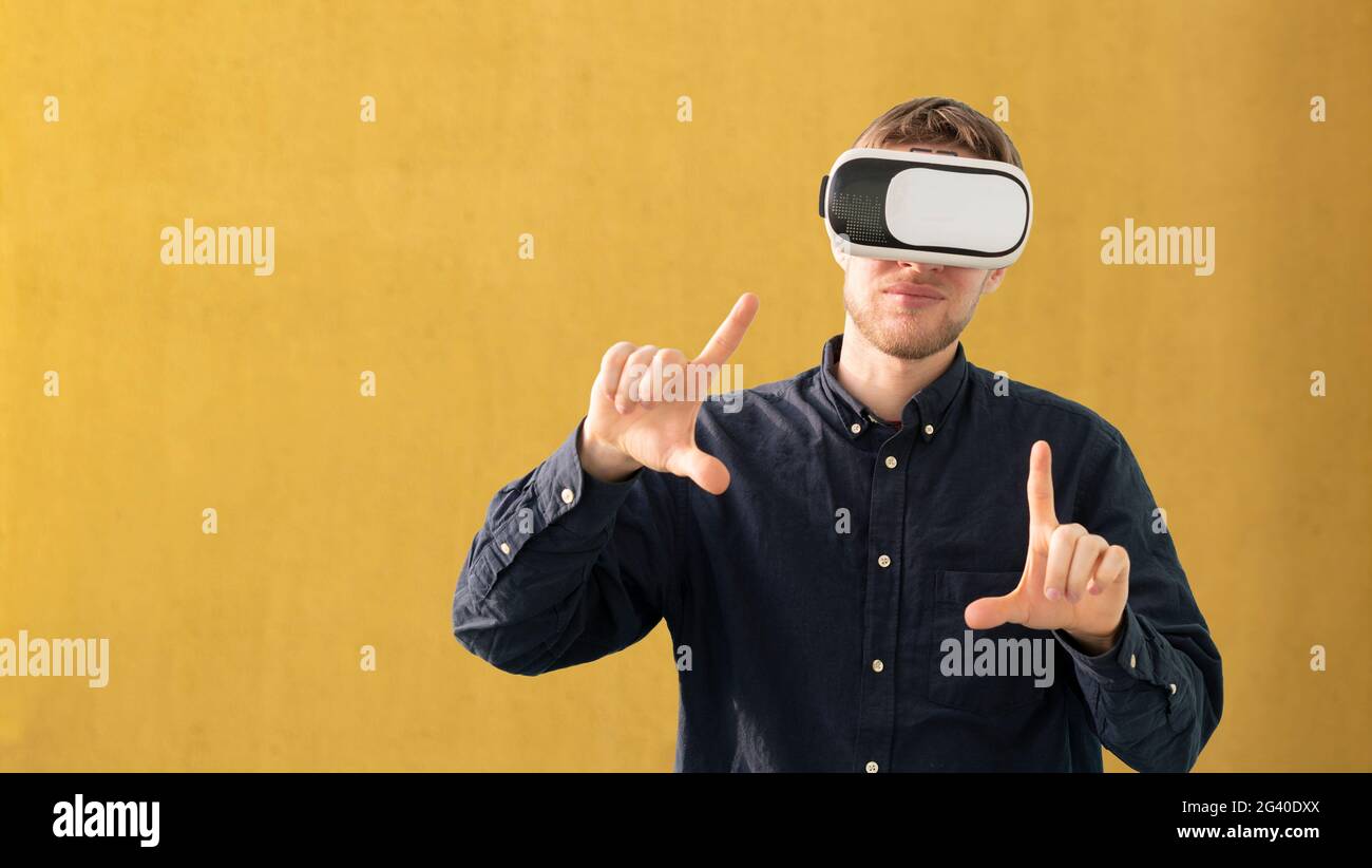 young man using futuristic virtual reality glasses, vr technology Stock Photo