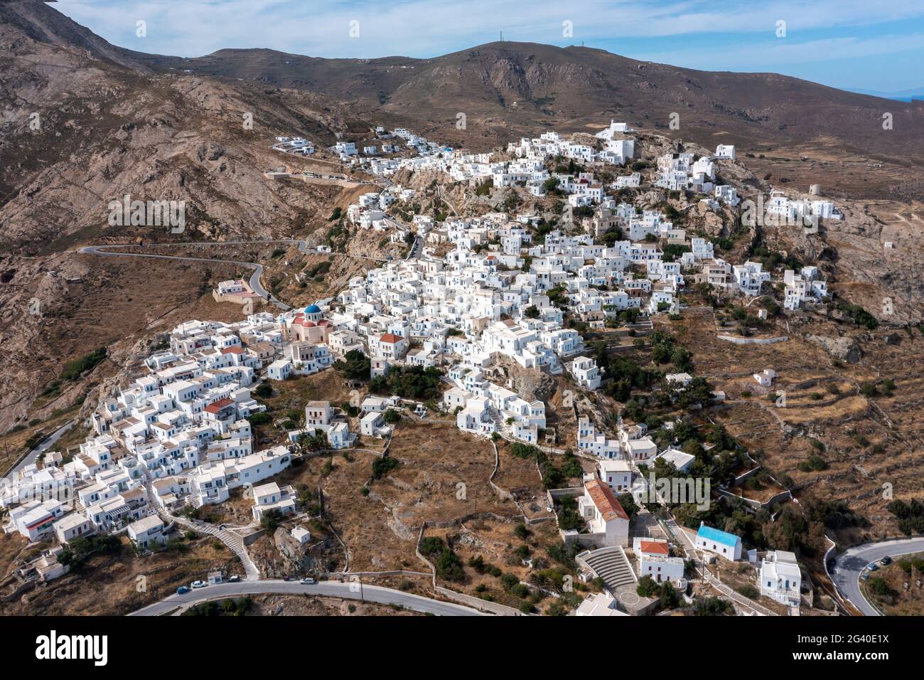 Serifos Cyclades islands, Greece. Chora town aerial drone view. Traditional Cycladic architecture, whitewashed buildings uphill on rocky land, blue sk Stock Photo
