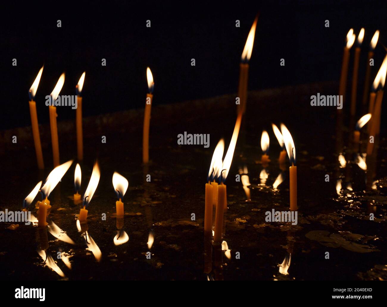 Candles burning in a church Stock Photo Alamy