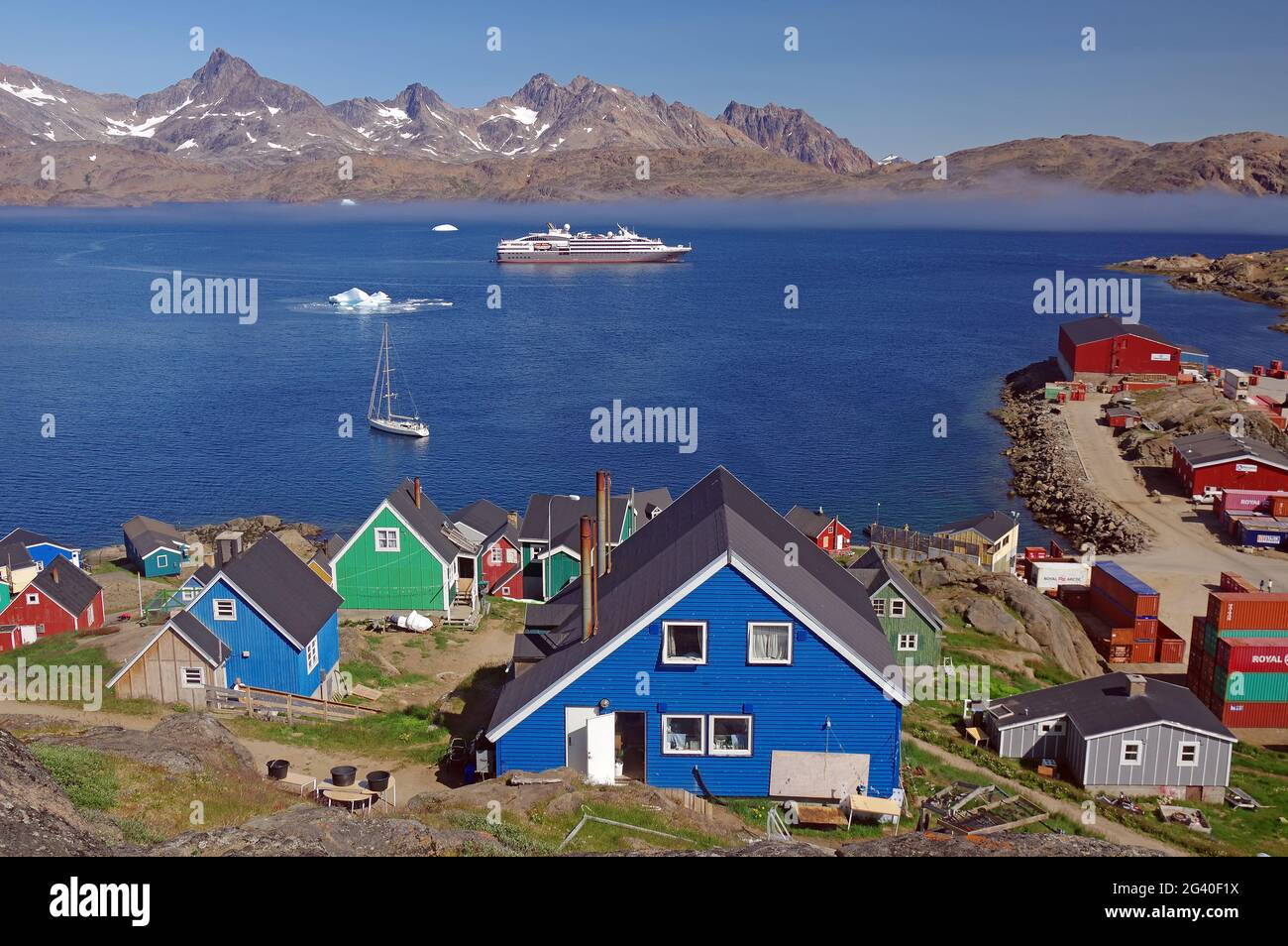 Colourful houses and cruise ship in Tasilaq, east greenland Stock Photo