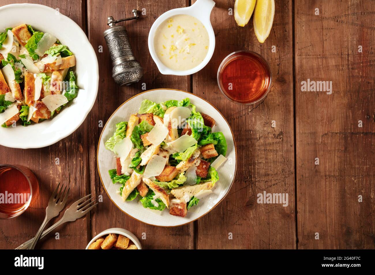 Caesar salad, shot from above on a dark rustic wooden background Stock Photo