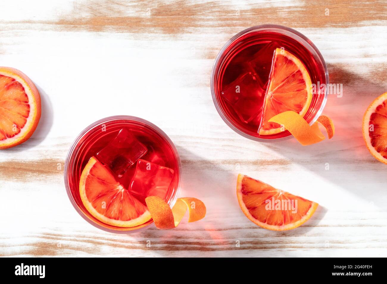 Cocktails with blood orange juice, overhead shot with copy space Stock