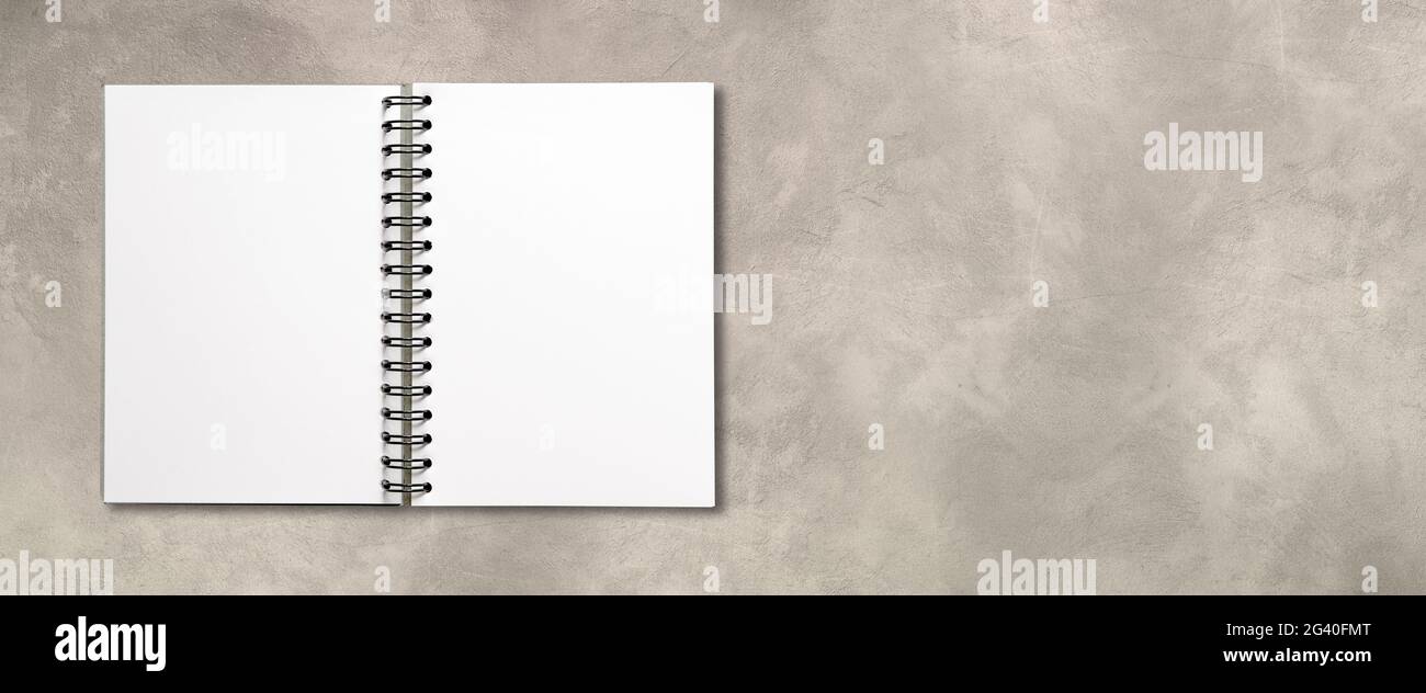 Blank open spiral notebook isolated on concrete banner Stock Photo - Alamy
