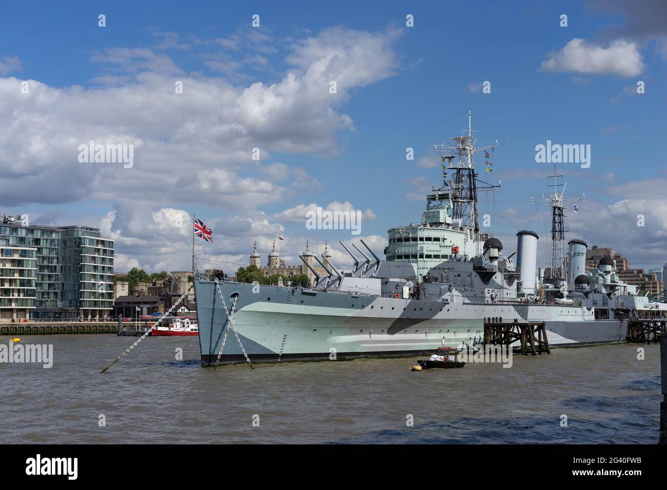 LONDON, UK - AUGUST 22 : HMS Belfast anchored near Tower Bridge in London on August 22, 2014. Unidentified people. Stock Photo