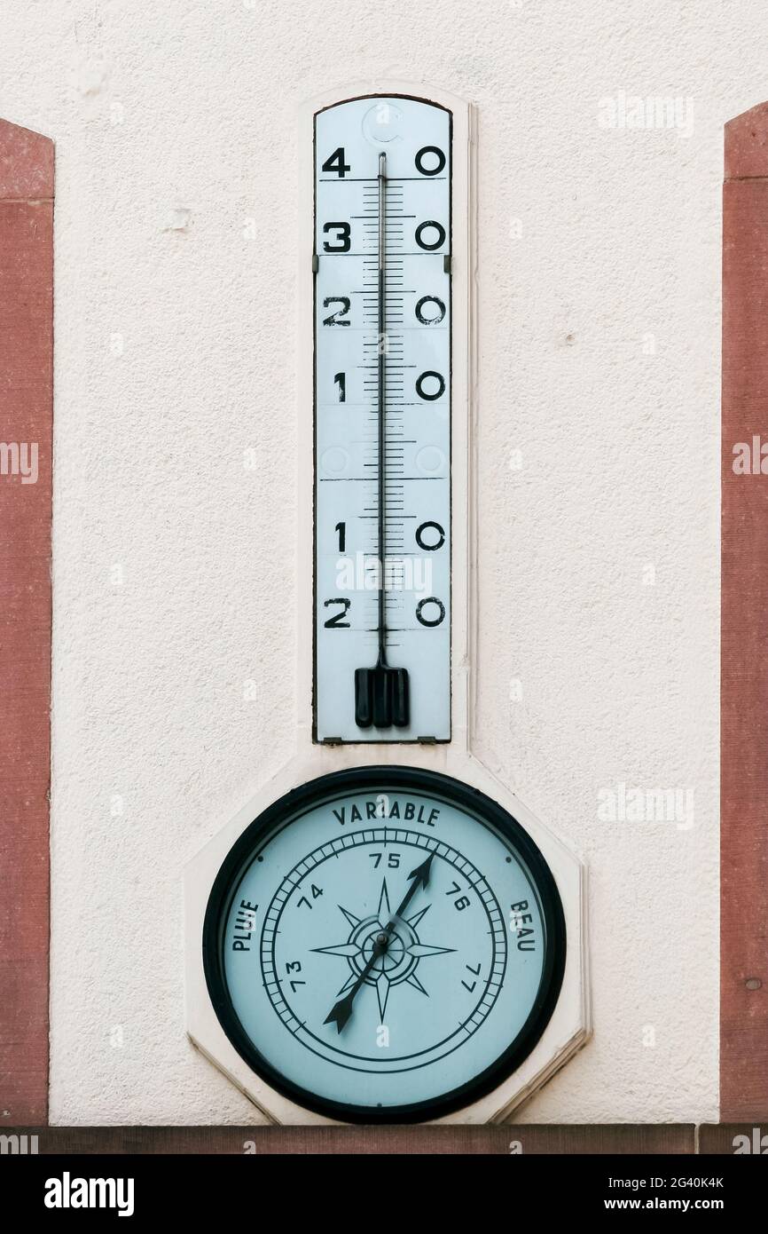 STRASBOURG, FRANCE/EUROPE - JULY 17 : Temperature gauge and barometer on a wall in Strasbourg on July 17, 2007 Stock Photo