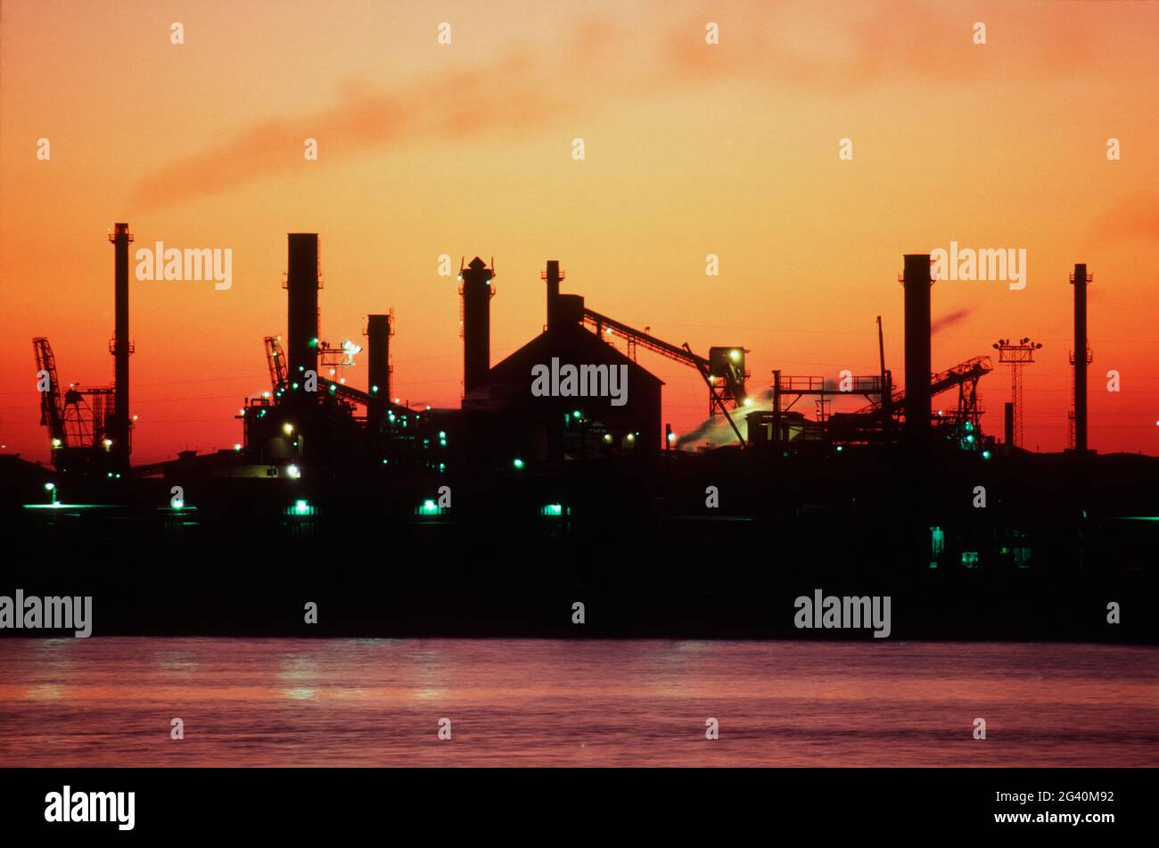 Silhouetted Coke Factory (fuel made from coal), Port Arthur, Texas. #387 S.TX Stock Photo