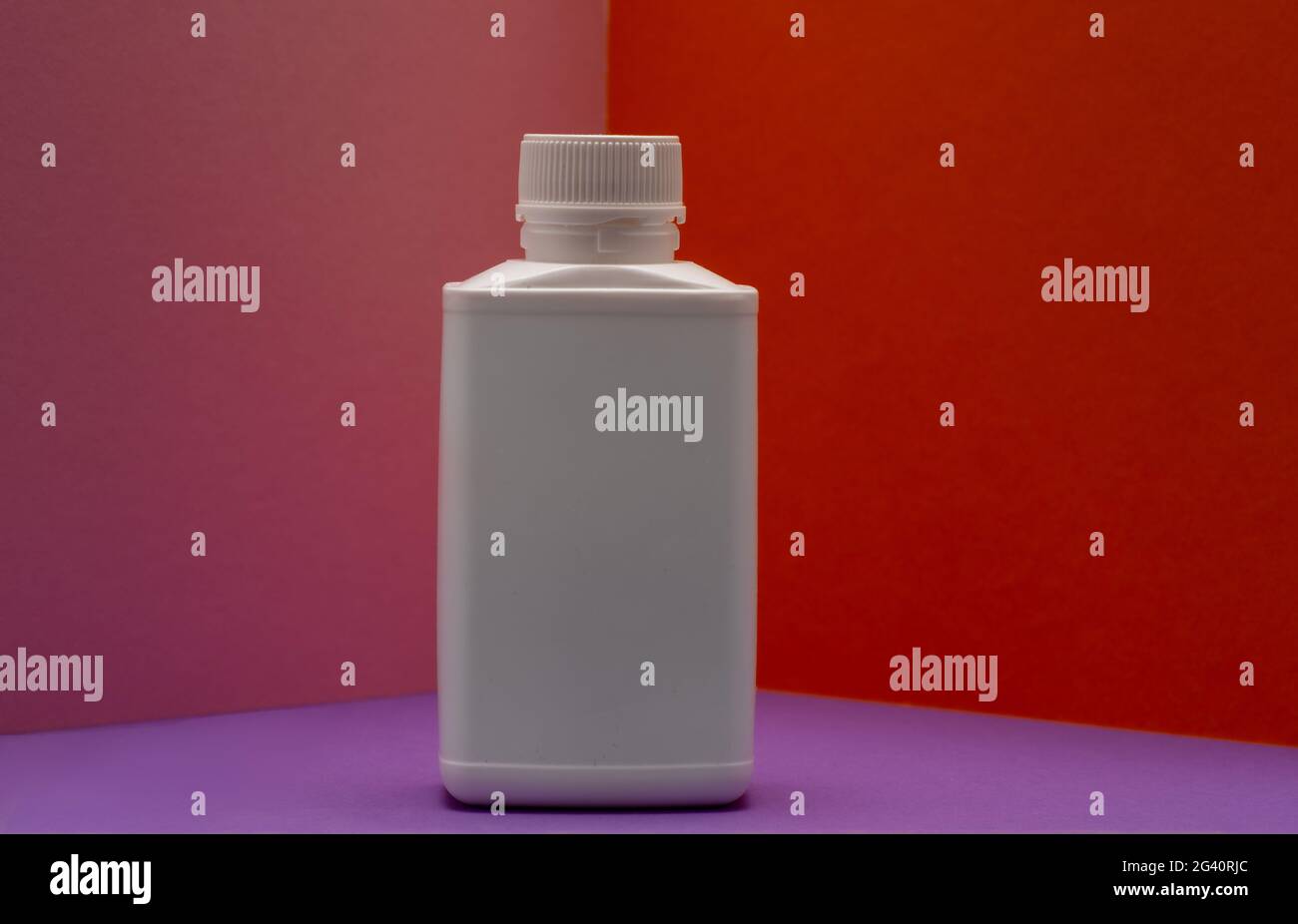 white mock up medicine or cosmetic bottle  on colourful background . Stock Photo