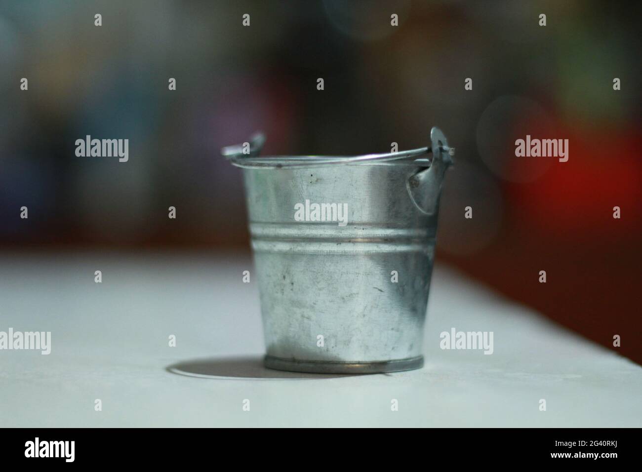 small iron bucket close-up on the table Stock Photo