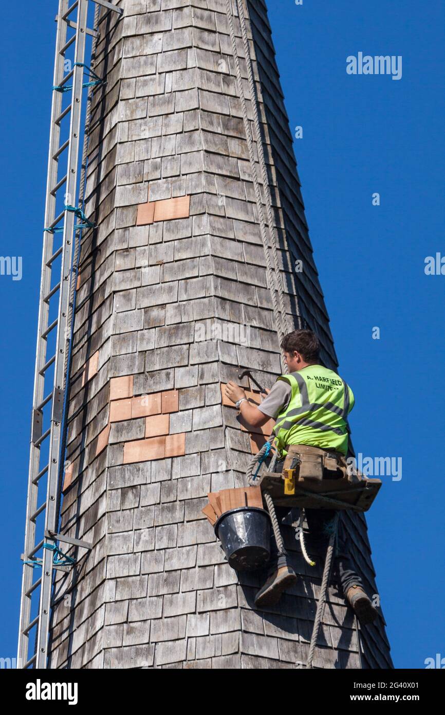 HORSTED KEYNES, SUSSEX/UK - OCTOBER 8 : Steeplejack working on the church roof at Horsted Keynes in Sussex on October 8, 2009. U Stock Photo