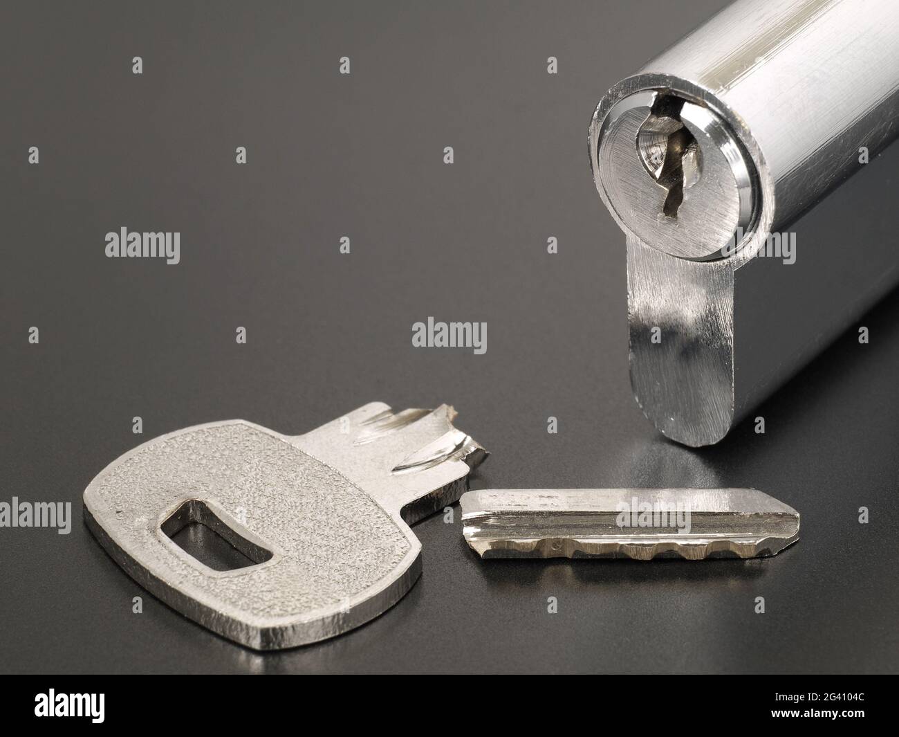 Pin tumbler of cylinder lock internal mechanism and broken key with copy space Stock Photo