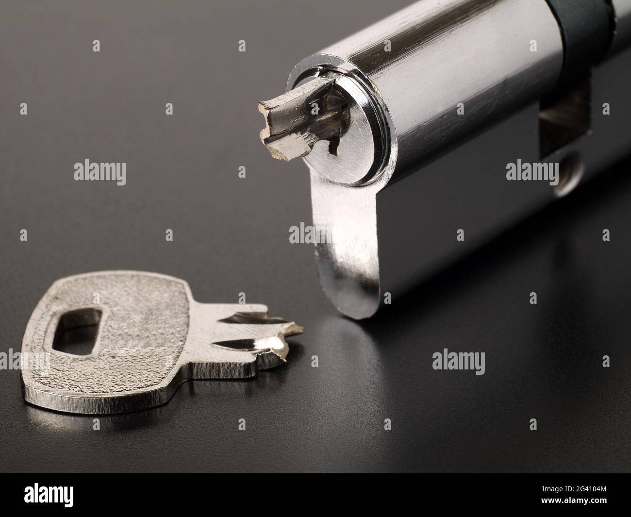 Pin tumbler of cylinder lock internal mechanism and broken key Stock Photo