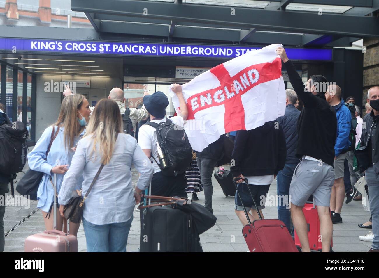 England fans at King's Cross station in London ahead of the UEFA Euro 2020 Group D match between England and Scotland at Wembley Stadium. Picture date: Friday June 18, 2021. Stock Photo
