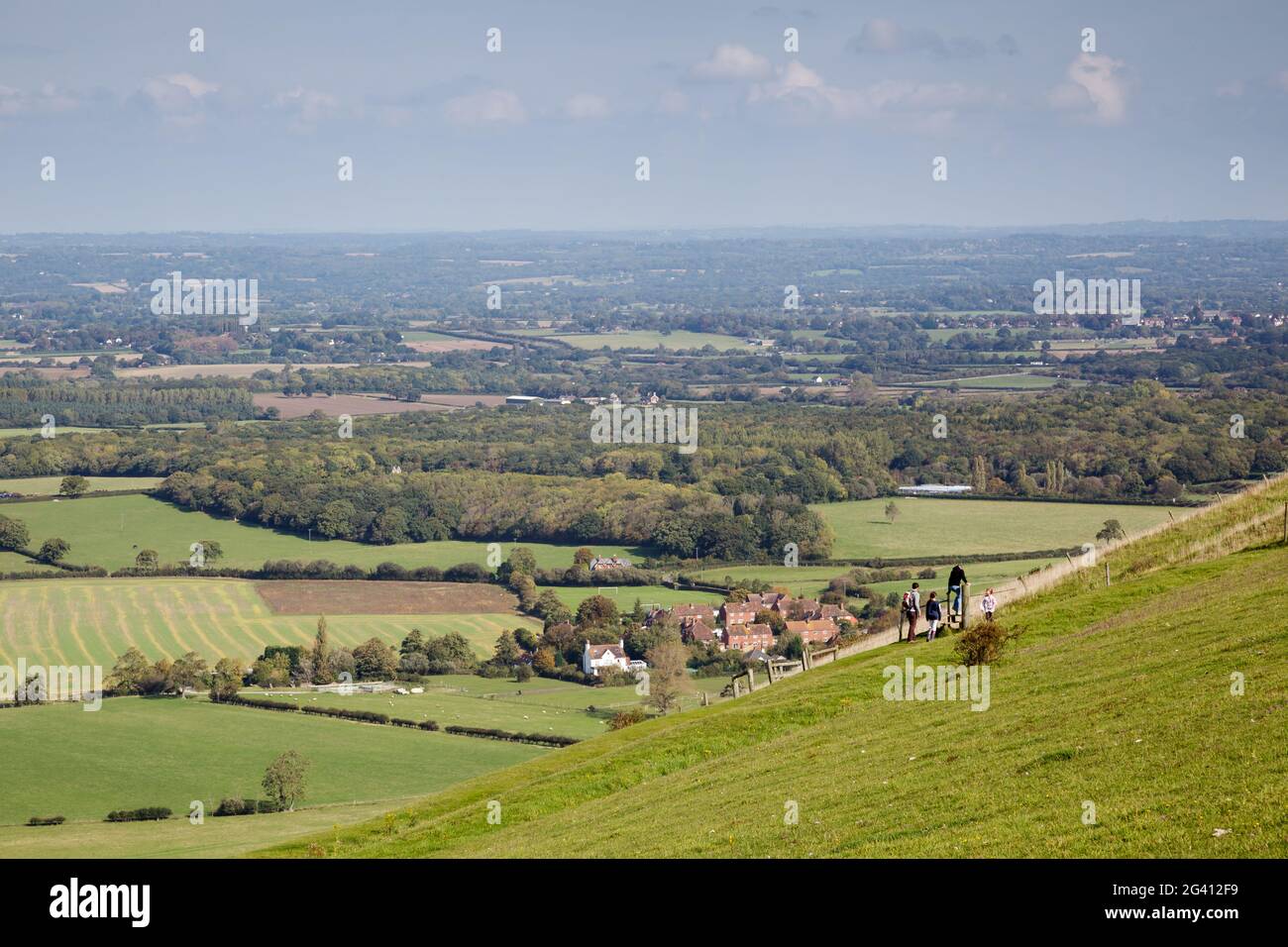 People waking  over the rolling Sussex countryside near Brighton Stock Photo