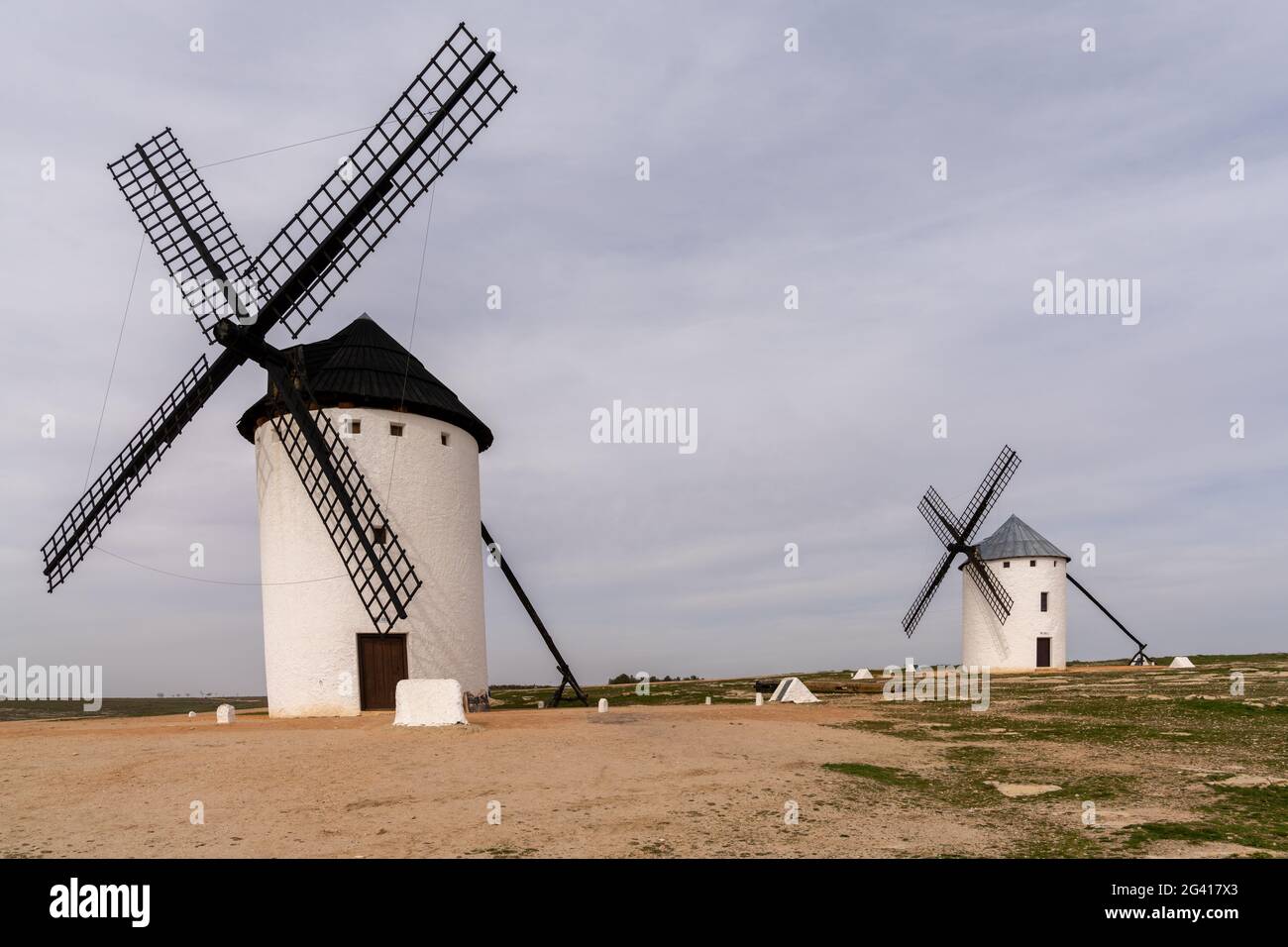 The historic white windmills of La Mancha above the town of Campo de Criptana Stock Photo