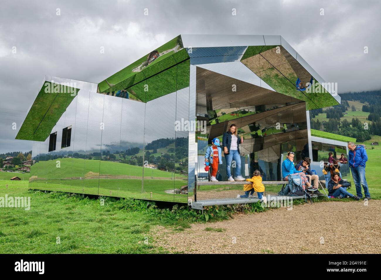 Several people visit Spiegelhaus, Mirror House, architect Doug Aitken