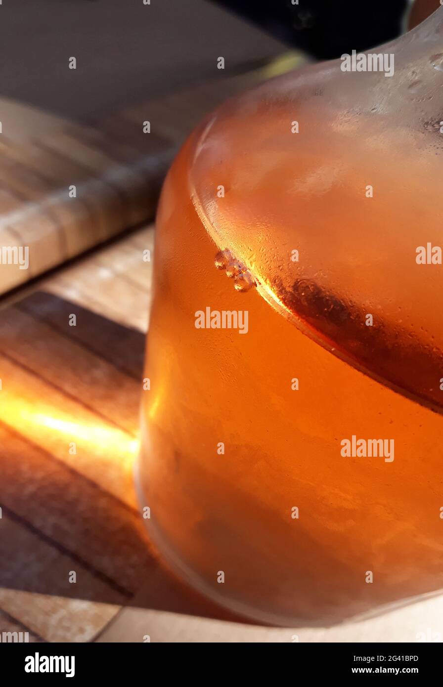 Carafe with wine on wooden table, detail Stock Photo