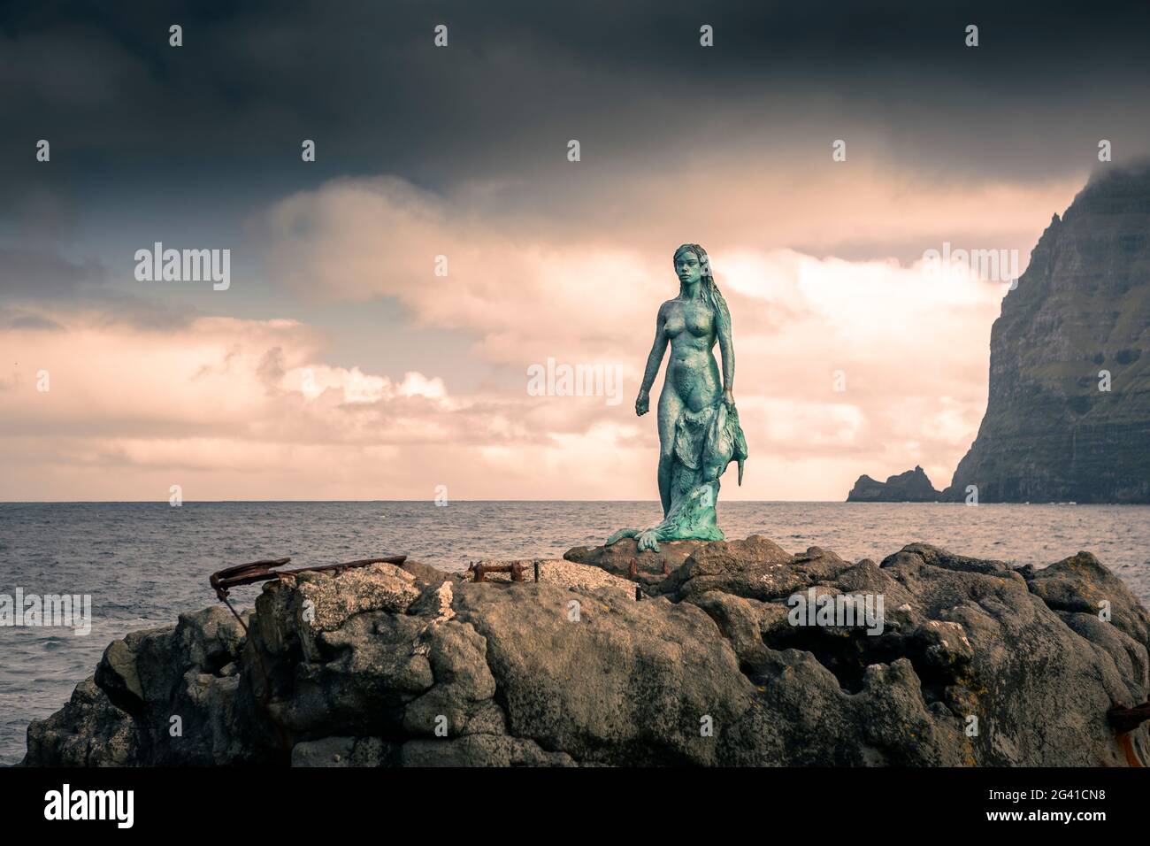 Statue of Kópakonan, mermaid in the village of Mikladalur on the island of Kalsoy, Faroe Islands Stock Photo