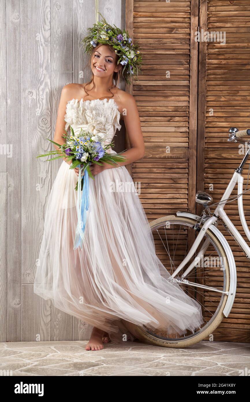 Young Bride On A Bicycle Stock Photo