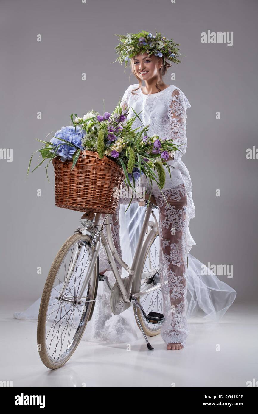 Young Bride On A Bicycle Stock Photo