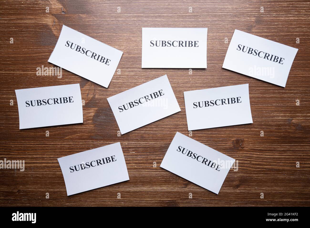 Some tickets with the word Subscribe arranged on the table, as a concept of the choice to subscribe Stock Photo