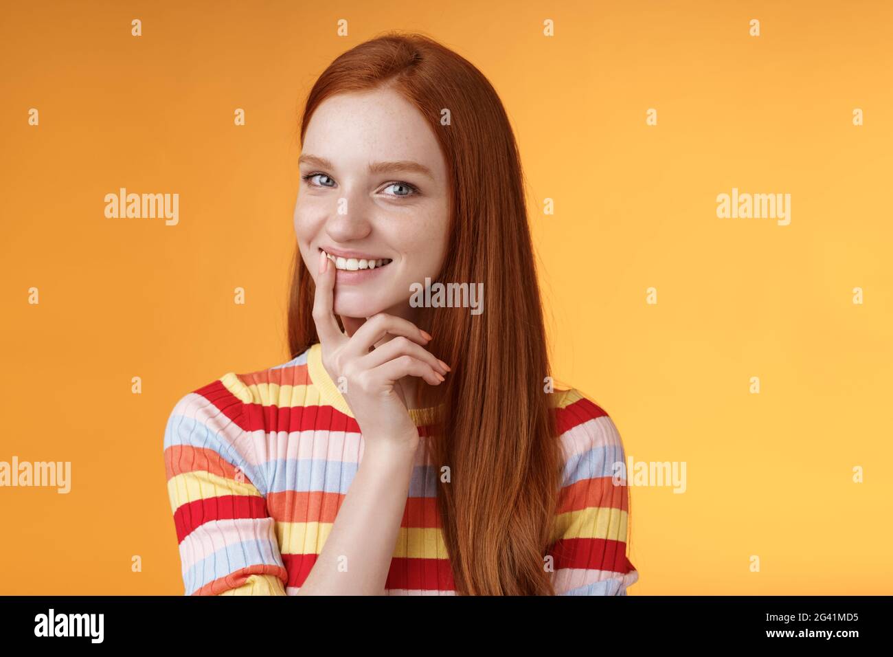 Curious devious redhead young 20s girlfriend have excellent idea smirking tricky touch lip flirty mysteriously glancing camera h Stock Photo